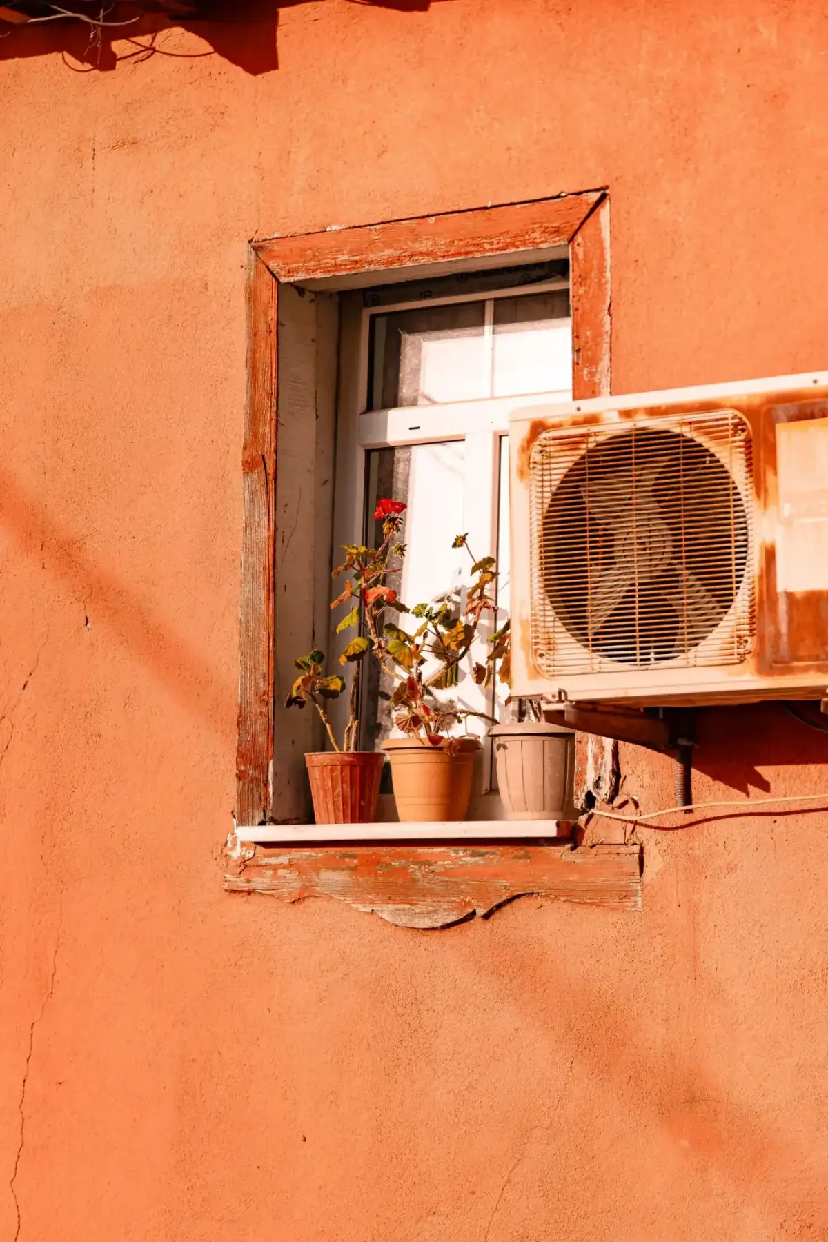 Before: Old rusted wall air conditioner